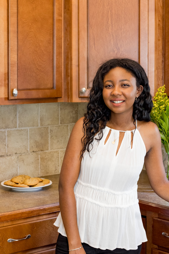 Woman smiling in the kitchen.