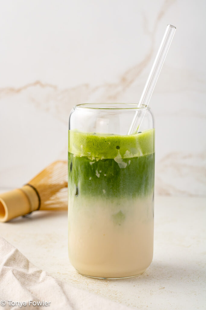 Oatmilk protein matcha latte in a glass.