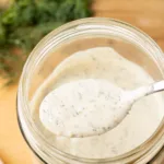 Dairy free ranch dressing on a spoon.