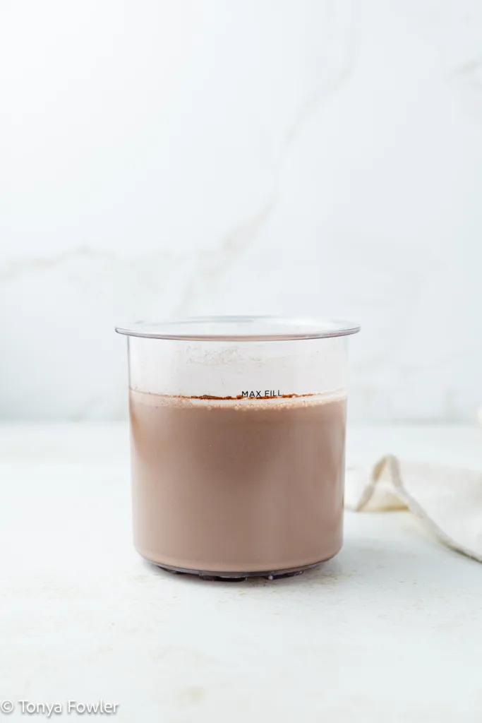 Chocolate ice cream base in a pint container.