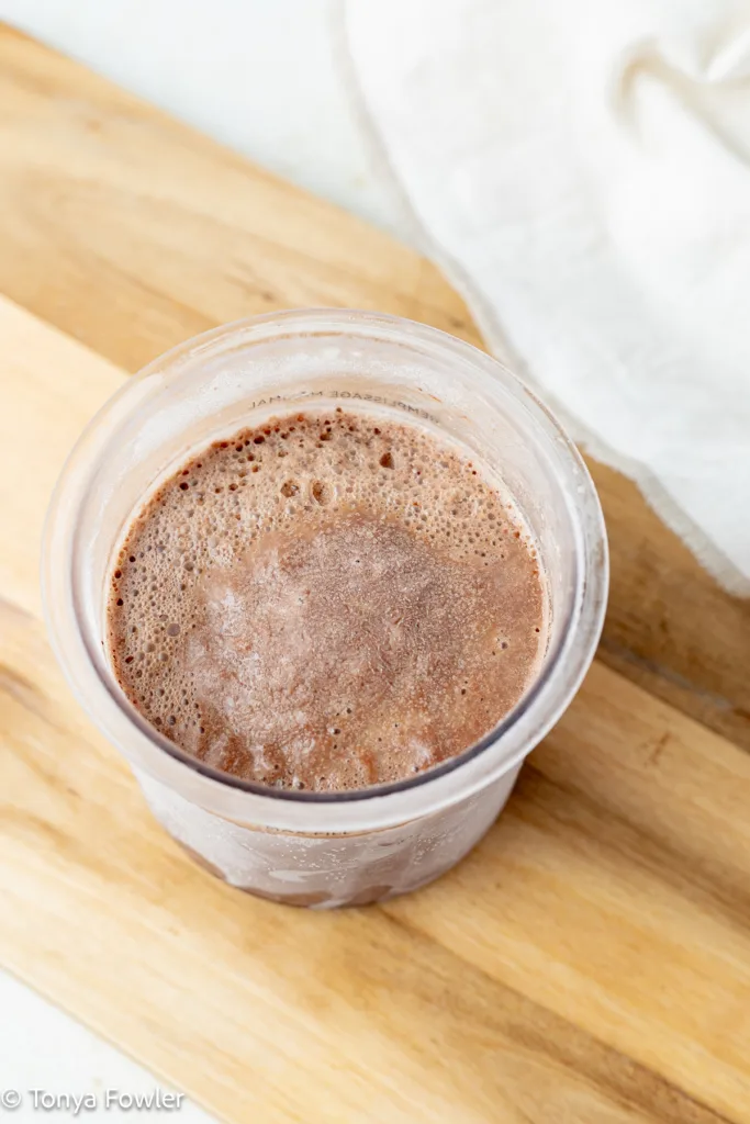 Frozen ice cream base in a pint container.