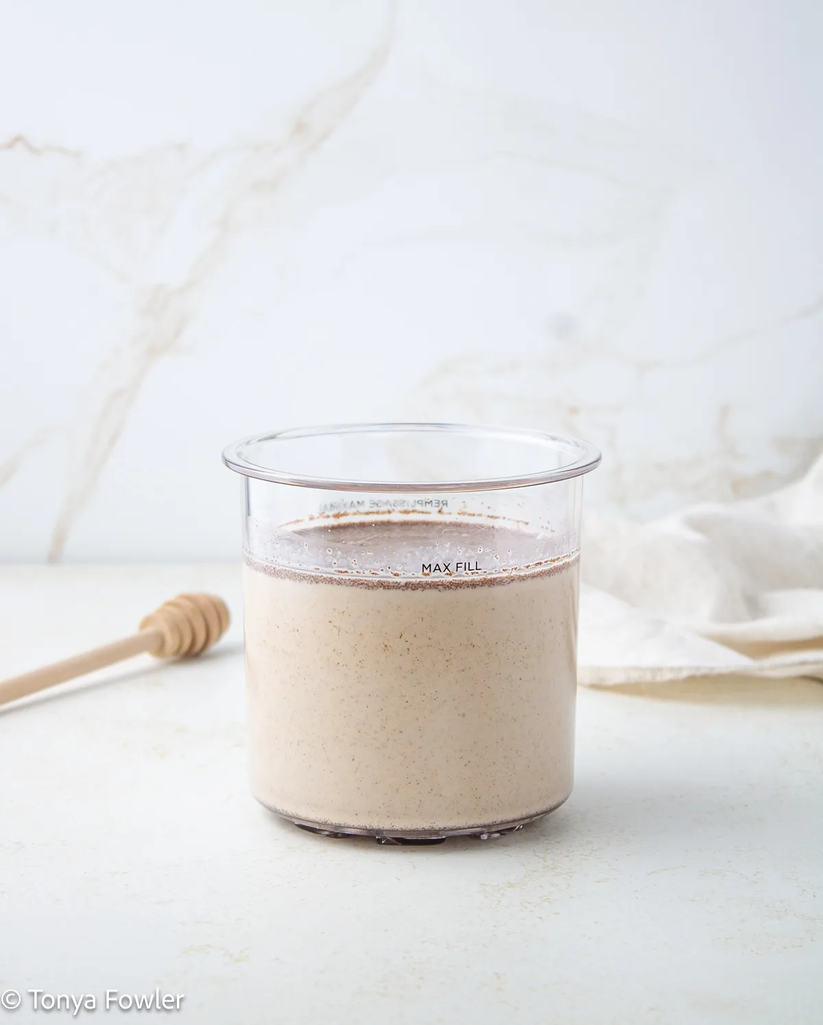 Honey ice cream base in a pint container.