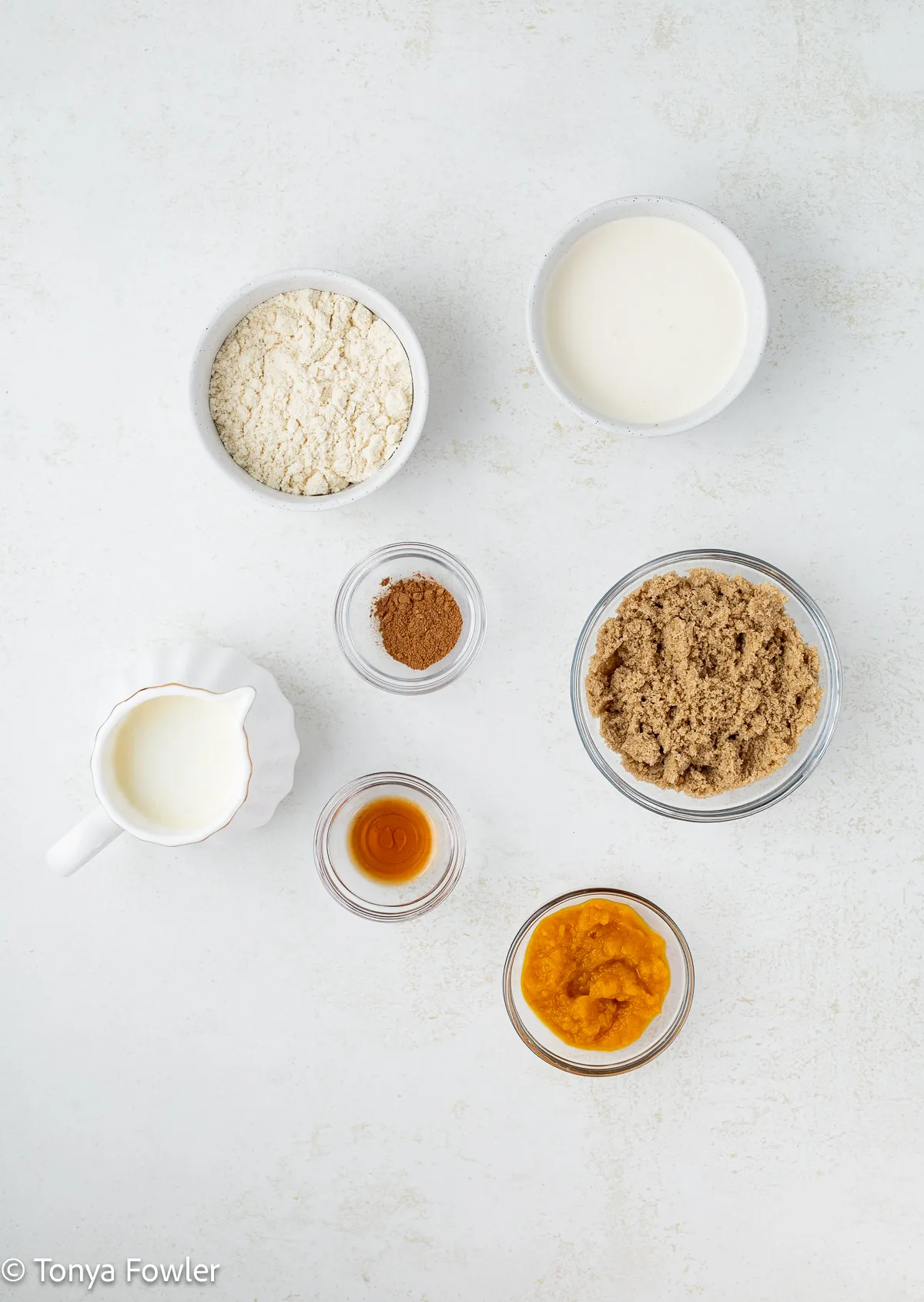 Ingredients for pumpkin ice cream on a counter.