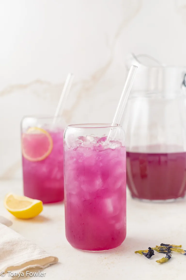 Glasses of butterfly pea flower lemonade.