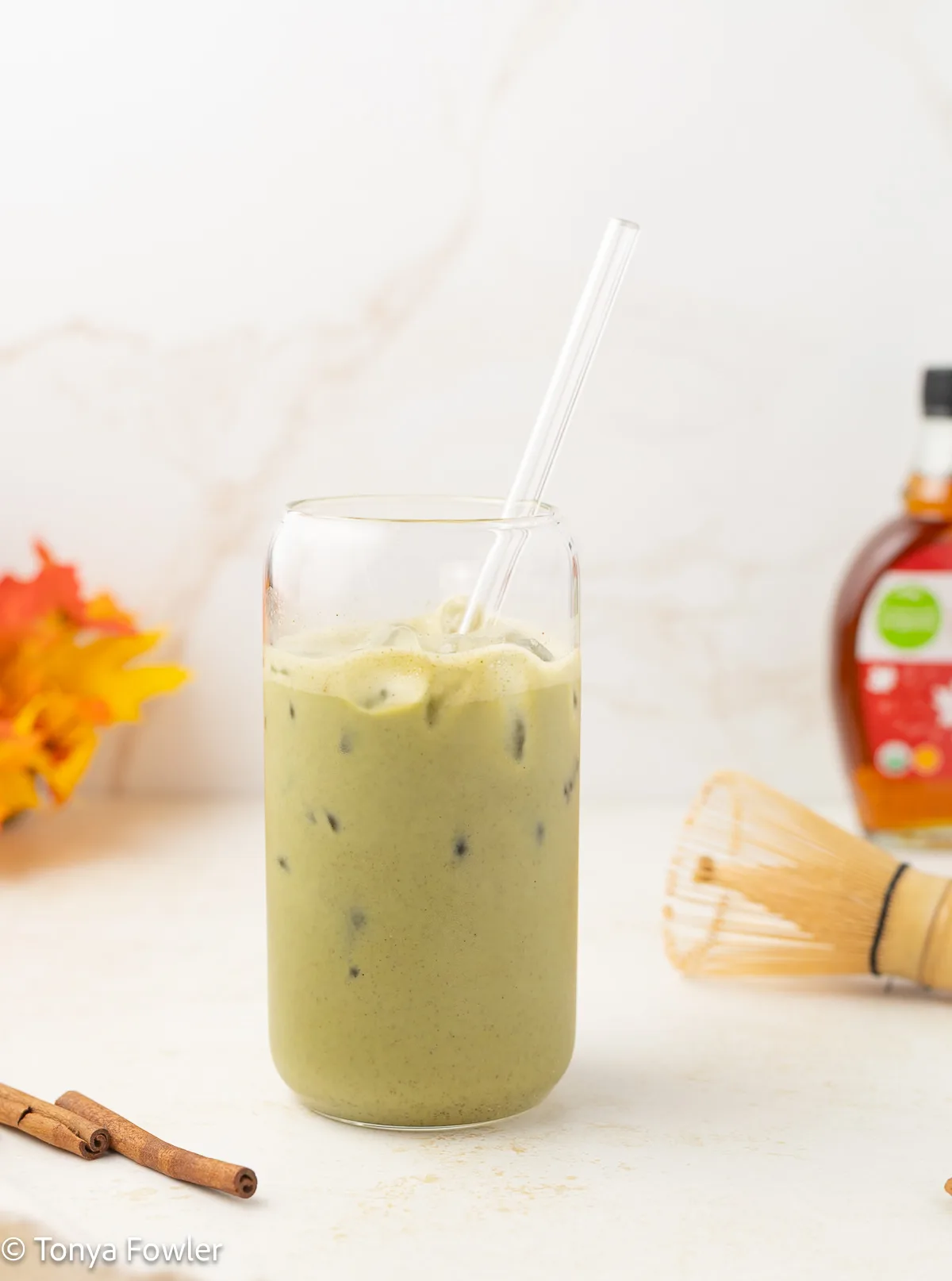 Cinnamon maple matcha latte in a glass.