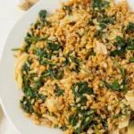 Overhead view of spinach einkorn salad on a plate.